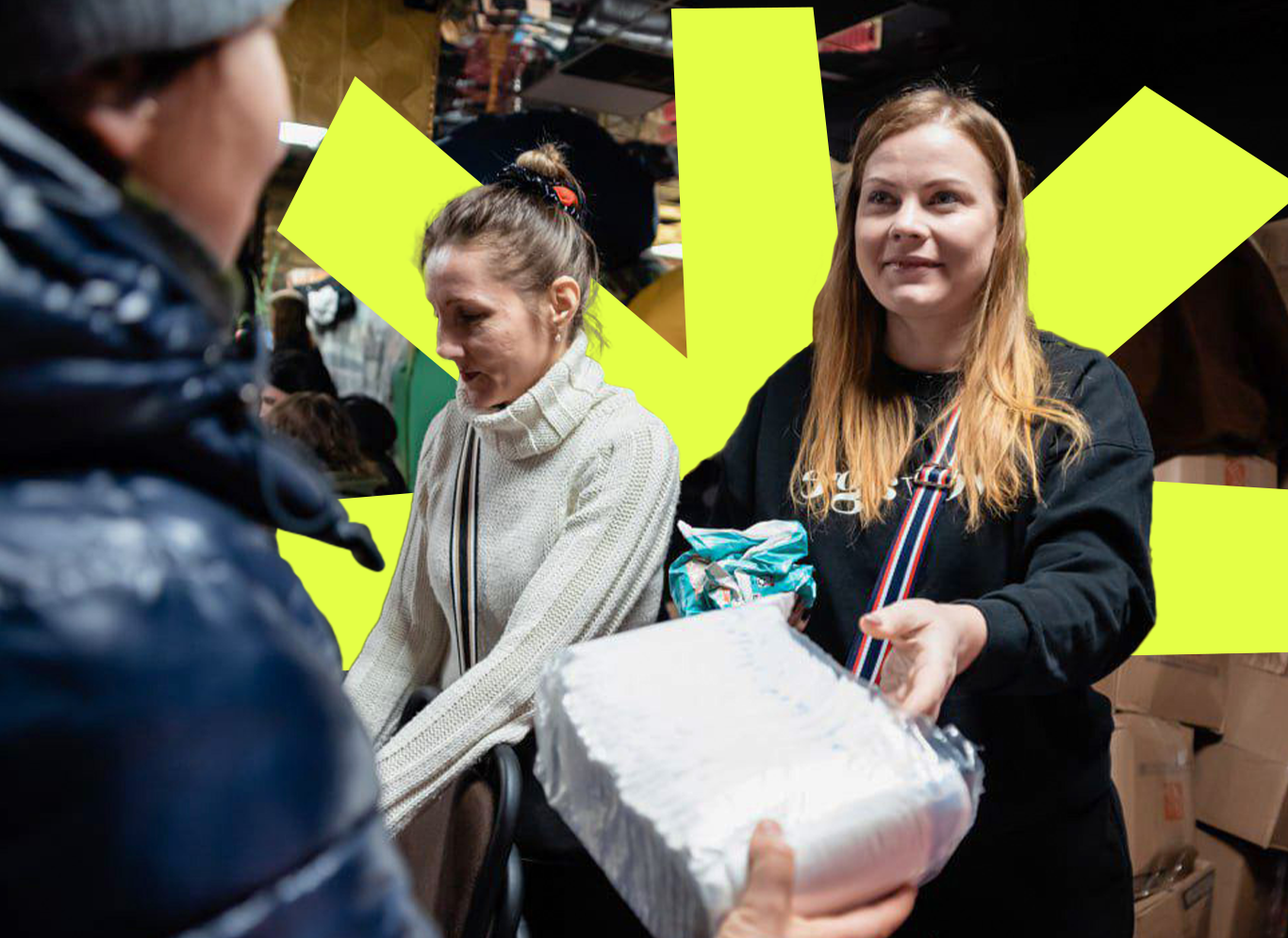 Woman passing a box to a person in the foreground. Yellow Sunrise icon in background.